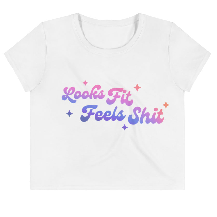 crop white tee with "looks fit feels shit" printed on the front in a purple to pink gradient