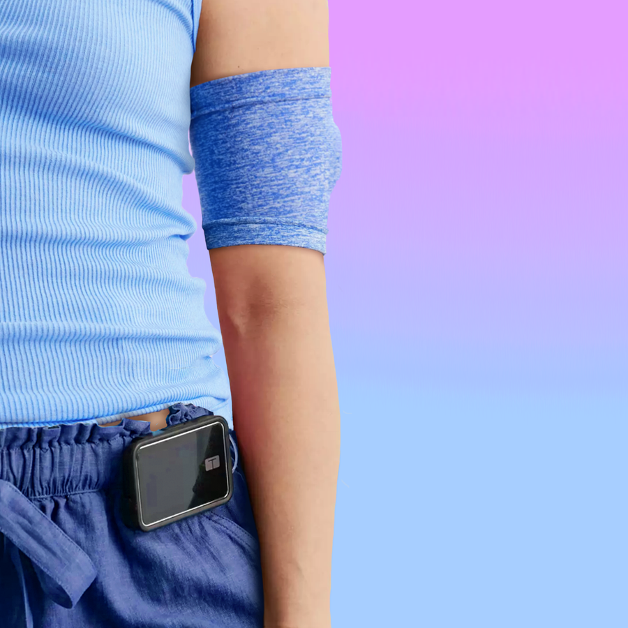 model with medical device and indigo bicep band freestyle glucose monitoring 