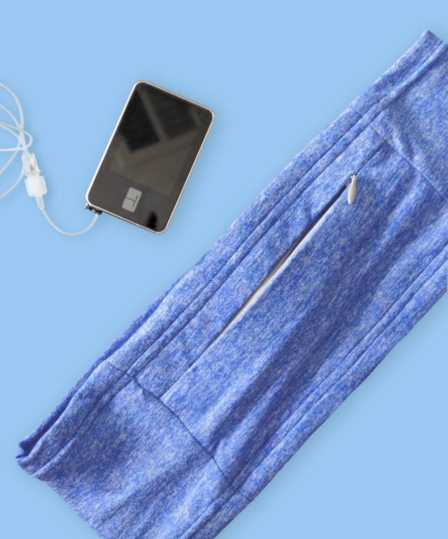 Single blue antimicrobial stretch waistband with hidden zipper pocket next to insulin pump DEXCOM, T slim, t1d